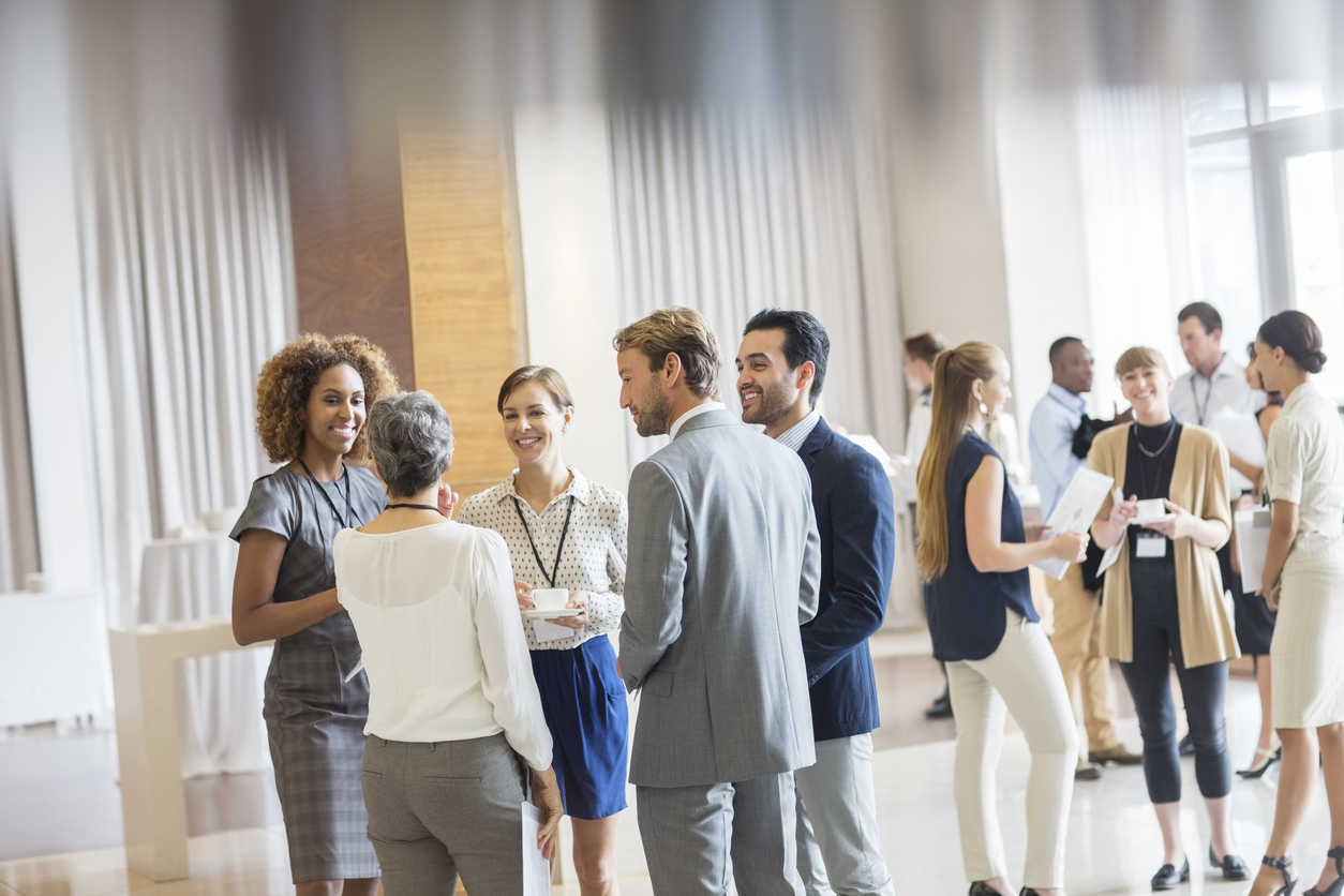 Professionals networking and communicating at a business event