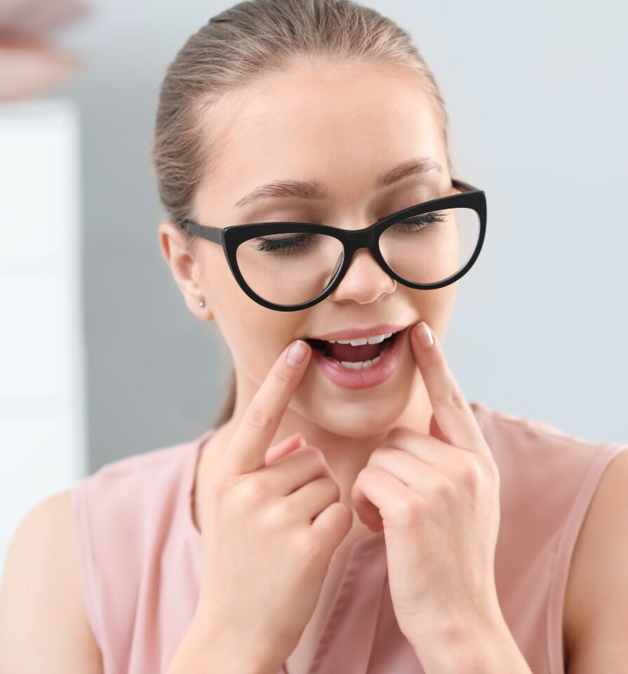 A woman practices lip positions