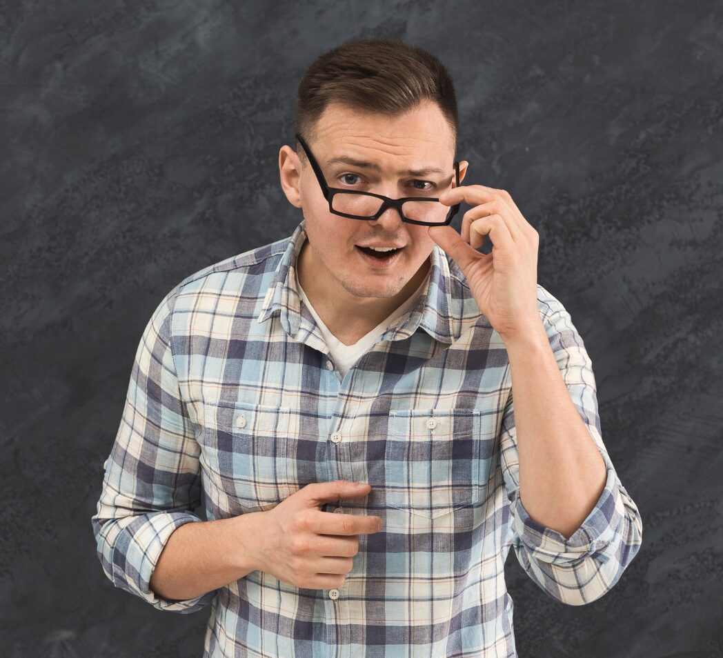 A man shows a confused face as he tries to understand the speaker.